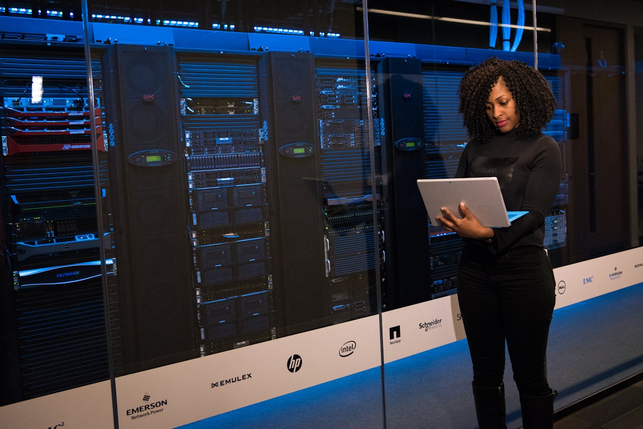A Veldtech engineer reviewing infrastructure in a server room